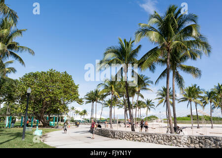 People walking on South Beach Boardwalk in Miami Beach, Florida, USA Stock Photo