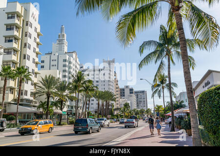 People and traffic on Collins Avenue in South Beach district of Miami Beach, Florida, USA Stock Photo