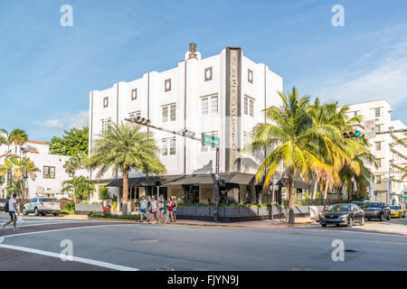 People and cars in front of Beach Plaza Hotel at corner of Collins Avenue and 14th Street in South Beach district of Miami Beach Stock Photo