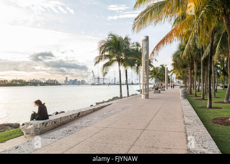 Waterfront promenade with people and harbour view,  South Pointe Park in South Beach district of Miami Beach, Florida, USA Stock Photo