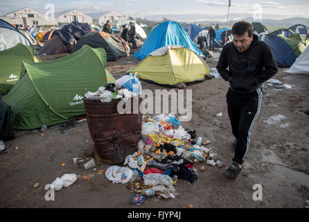 Idomeni, Greece. 04th Mar, 2016. Refugees walk through a refugee camp ...