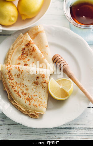 Lemon pancakes with honey Stock Photo