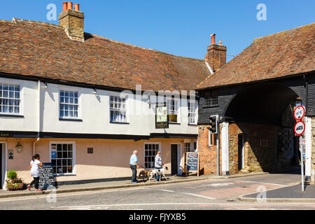 Street scene outside16th century Crispin Inn by 14th century Barbican Gate in historic town of Sandwich Kent England UK Britain Stock Photo