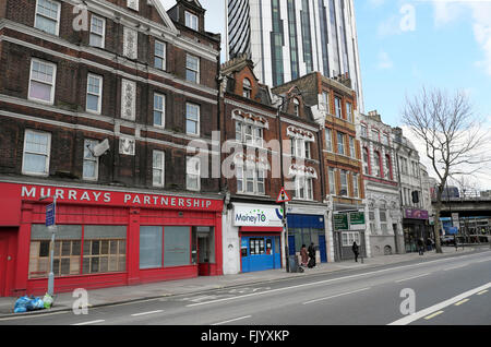 Row of flats above shops and Murrays Partnership Solicitors office exterior sign on Walworth Road buildings Elephant & Castle London UK KATHY DEWITT Stock Photo
