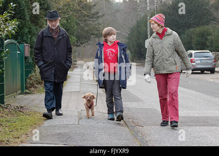 grandparents and grandson going for a walk Stock Photo