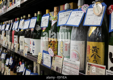 Bottles of Sake on Display in Akita Public Market, Akita, Japan Stock Photo