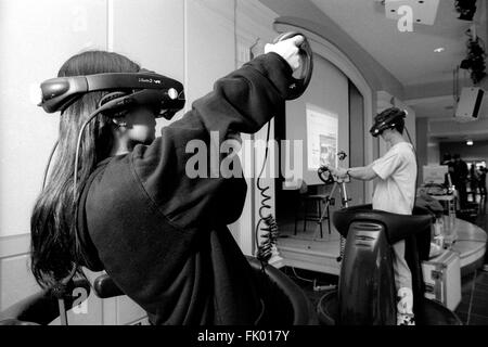 4-Mar-1997, Champaign, Illinois (USA): Impressed by the possibilities of virtual reality, students equipped with headsets and 3D-virtual reality goggles explore the cyberspace. Together with others they had the opportunity to gather information about virtual reality's state of the art at the University of Illinois' open day on March 4-5, 1997. Stock Photo
