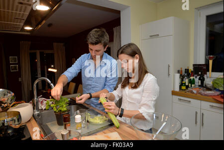 Young couple cooking together, Germany Stock Photo
