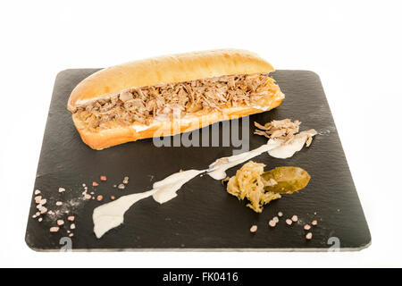 Sandwich with Meat Cutlet Pork on Granite Chopping Board Plate with Sauerkraut Cabbage Salad on White Background. Sandvich with  Stock Photo