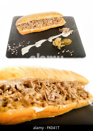 Sandwich with Meat Cutlet Pork on Granite Chopping Board Plate with Sauerkraut Cabbage Salad on White Background. Sandvich with  Stock Photo