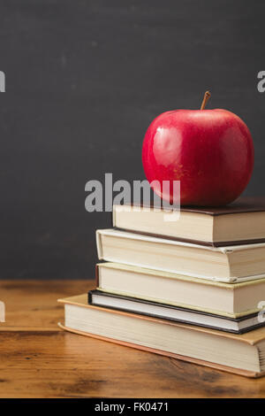 Apple and stack of books Stock Photo