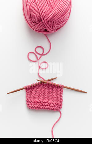 Incomplete knitting project with wooden needles Stock Photo