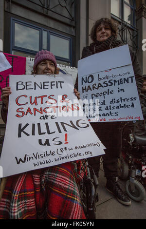 London,UK. 4th Mar 2016. Two people make their point as Protesters demonstrated at a GP surgery taking part in the DWP’s trial to bring JobcentrePlus into GP surgeries for “intensive employment coaching” which disability rights groups see as forced treatment and a violation of human rights. David Rowe/Alamy Live News. Stock Photo