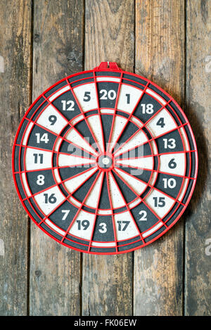 Target dartboard on a wooden wall with no hits Stock Photo