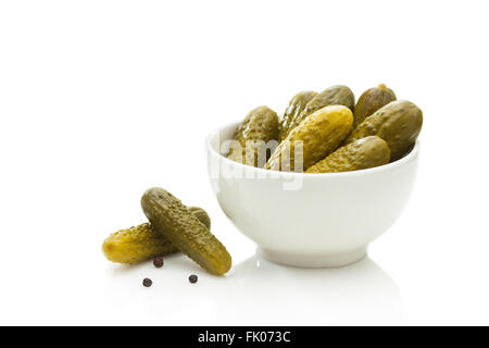 Pickled green gherkins on white background Stock Photo