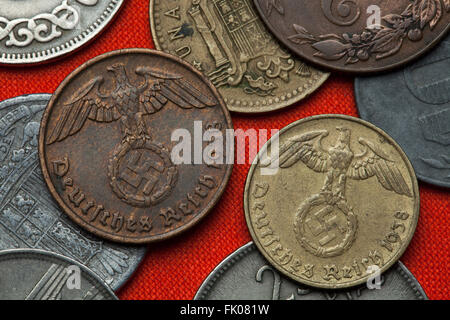 Coins of Nazi Germany. Nazi eagle atop swastika depicted in the German Reichsmark coins (1938). Stock Photo