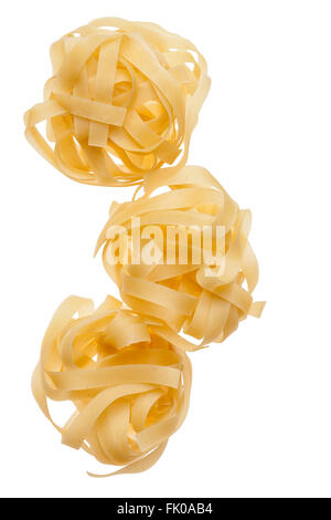 Uncooked raw pasta tagliatelle. Stock Photo