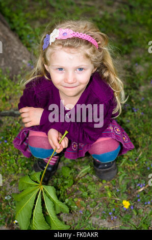 beautiful blond girl looking up Stock Photo