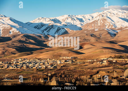 Snow capped peaks of Zagros Mountains of Lorestan Province Iran, below Borujerd. Golden, early morning light. Stock Photo