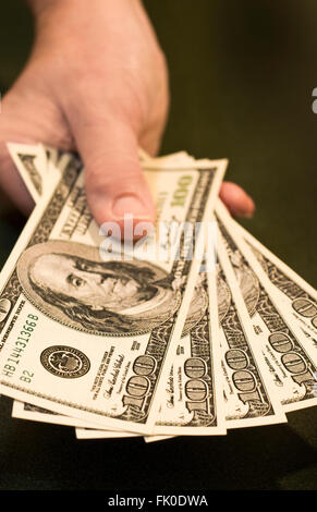 Hand With Hundreds Stock Photo