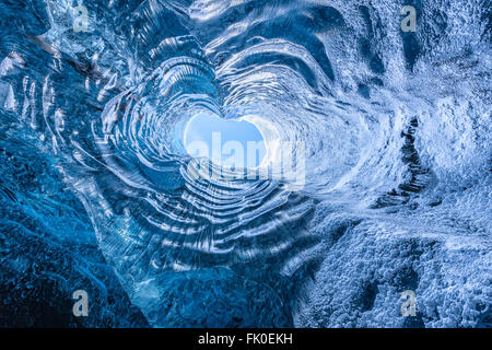 Looking up through a opening in a glacier cave in Iceland Stock Photo