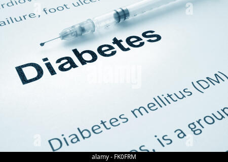 Paper with word diabetes and syringe. Stock Photo