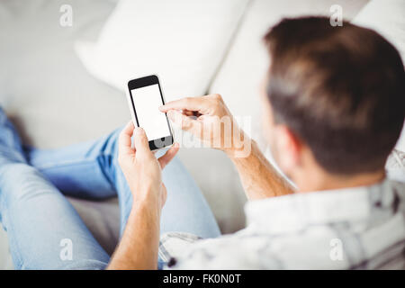 Rear view of man using mobile phone Stock Photo