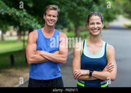 Fit people posing with crossed arms Stock Photo