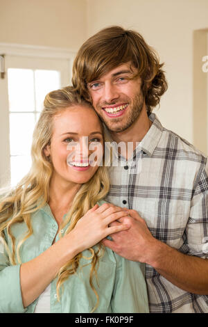 Cute couple hugging with arms around Stock Photo