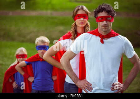 Happy family pretending to be superhero Stock Photo