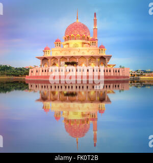 Sunset over Putrajaya Mosque and Panorama of Kuala Lumpur, Malaysia. Stock Photo