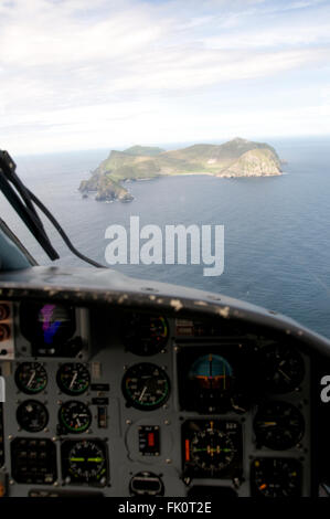 Dauphin helicopter approaching St Kilda for Quinetiq crew change. Stock Photo
