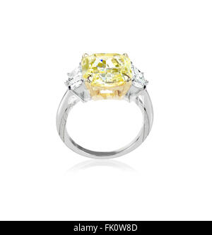 Side view canary yellow diamond engagment ring set with two white clear diamonds on each side Stock Photo