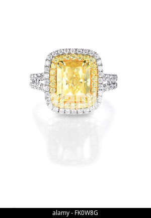 Yellow Canary Diamond Large Engagment Ring in Halo Setting, emerald cushion cut stone with a double halo of diamonds on the side Stock Photo