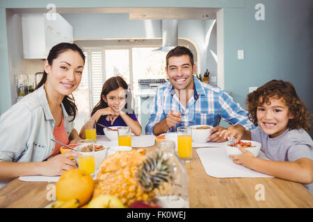 Portrait of happy family having breakfast Stock Photo
