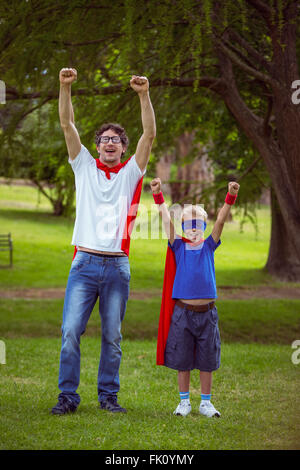 Father and son pretending to be superhero Stock Photo