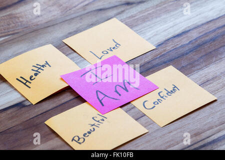 very powerful self help concept using positive messages and a I am floating above all the positive thoughts Stock Photo