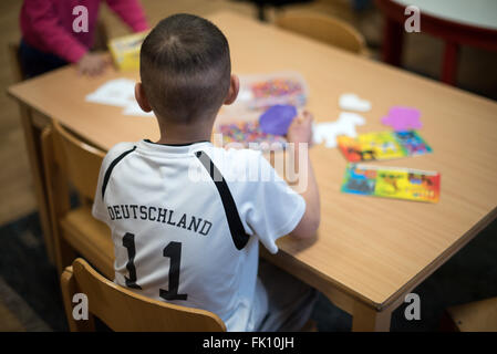Berlin, Germany. 3rd Mar, 2016. Refugee children playing in a residential home for fled women and families in Berlin, Germany, 3 March 2016. Photo: Bernd von Jutrczenka/dpa/Alamy Live News Stock Photo