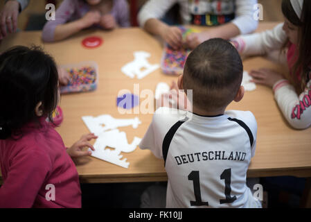 Berlin, Germany. 3rd Mar, 2016. Refugee children playing in a residential home for fled women and families in Berlin, Germany, 3 March 2016. Photo: Bernd von Jutrczenka/dpa/Alamy Live News Stock Photo