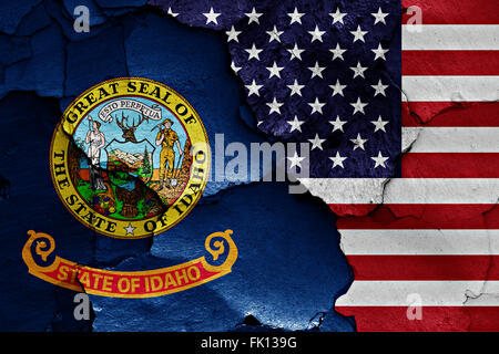 flags of Idaho and USA painted on cracked wall Stock Photo