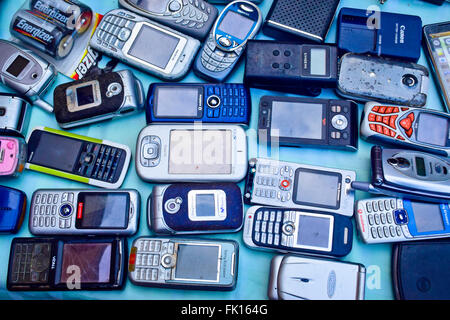 Used smartphones and mobile phones to sell in a market. Stock Photo