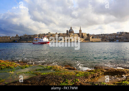 Cruise ship passing through Sliema Creek towards Floriana, Valletta, Malta. Stock Photo