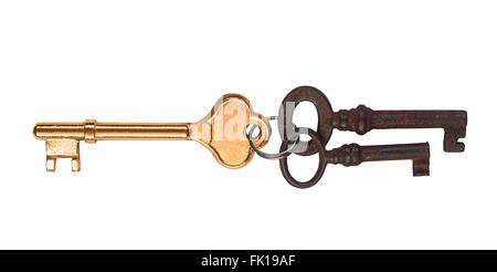 A golden key and two rusted ones. Stock Photo