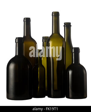 Horizontal front view of a group of empty wine bottles of different sizes, shapes and color isolated on white background. Stock Photo