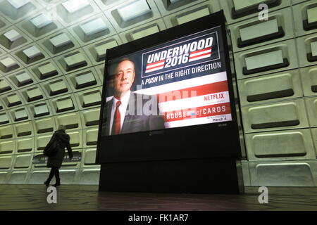 Washington, DC, USA. 04th Mar, 2016. A woman walks past an advertising panel for the new season of the US television series 'House of Cards' in a subway station in Washington, DC, USA, 04 March 2016. Photo: MAREN HENNEMUTH/dpa/Alamy Live News Stock Photo