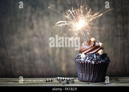 Chocolate cupcake with a sparkler Stock Photo