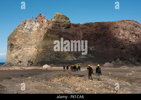 Tourists visiting the crater of active volcano White Island 48 km off the coast of New Zealand in the Bay of Plenty. Stock Photo