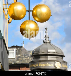 Pawn shop sign of three gold balls above Pawnbroker premises Barking East London England UK in London Borough of Barking and Dagenham Stock Photo