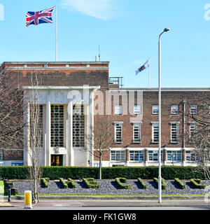 Town Hall offices in original Dagenham Civic Centre with The Civic sign formed in topiary all now part of East London Borough of Barking and Dagenham Stock Photo