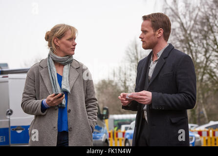 Dortmund, Germany. 01st Mar, 2016. Actors Anna Schudt (L) as inspector Martina Boenisch and Stefan Konarske as inspector Daniel Kossik pictured during a break as the episode 'Zahltag' (pay day) of the German television series Tatort (crime scene) is filmed in Dortmund, Germany, 01 March 2016. Photo: BERND THISSEN/dpa/Alamy Live News Stock Photo